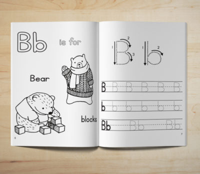 Photo of an open Learn to Write book showing letter tracing and coloring activity pages for the letter B