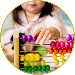 child learning math playing with a colorful abacus